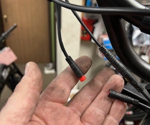 photo showing bicycle cable with disconnected interlock