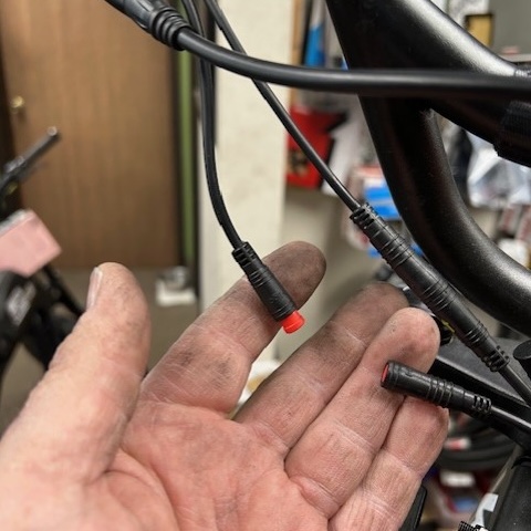 photo showing bicycle cable with disconnected interlock— a common way kids modify ebikes.